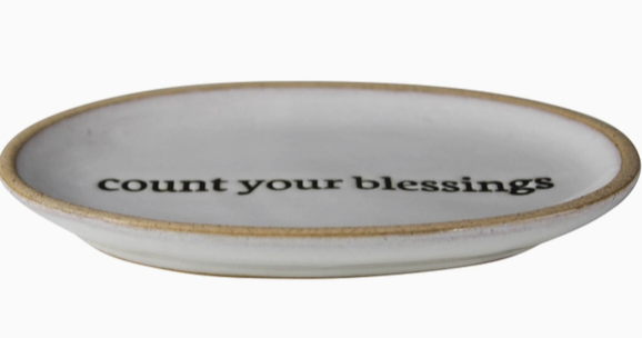 "Count Your Blessings" oval ceramic tray a glossy white glaze from India.