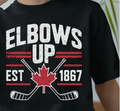 "Elbows Up Est. 1867"-Canadian Hockey Design from Mexico. Premium 100% cotton